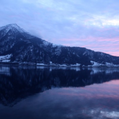 The Rigi from Walchwil at sunset, pink and lavender reflections across the lake