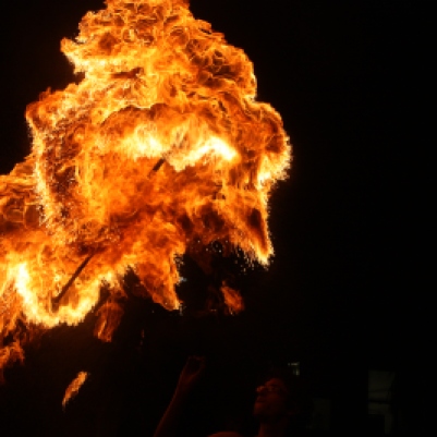 Fireball from a fire twirler using a double ended staff